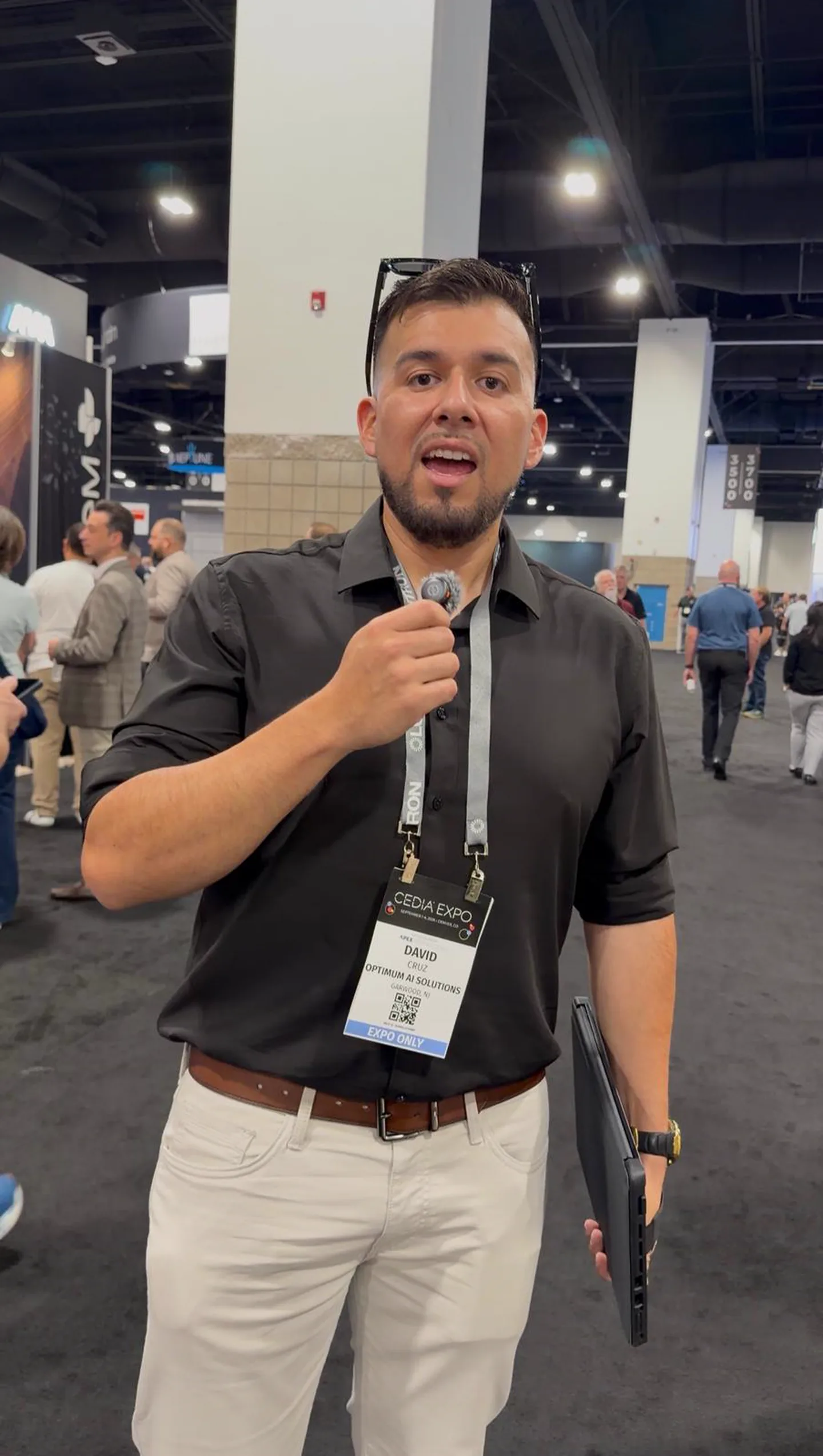 David Cruz on the floor at CEDIA Expo 2026, badge reading Optimum AI Solutions, Garwood NJ